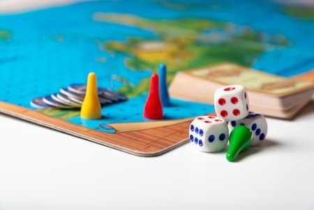 colorful-game-pieces-with-dice-on-board-2025-01-08-03-54-21-utc.jpg